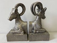 Front view of both silvered metal ram bookends