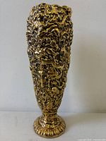 Full front view of gilt ceramic vase