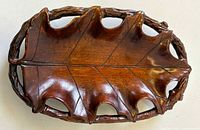 Top view showing oak leaf carving and branch rim