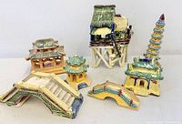 All seven ceramic village pieces grouped