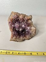 Front view showing amethyst crystals and tape for scale