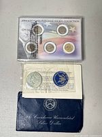 Eisenhower dollar envelope, certificate, mylar-sealed coin, and nickel set view