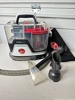 Main unit with hose, hand tool, nozzle, brush attachment and accessory bag