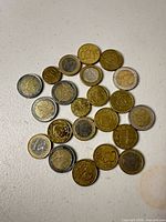 All coins spread out showing obverse and reverse sides