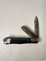 Pocket knife open showing both blades and handle