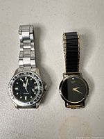 Both wristwatches side by side showing overall style and size
