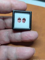 Pair of oval pink tourmalines in display box