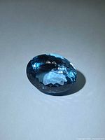 Top view of oval faceted Swiss blue topaz showing color and cut
