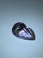 Pear-cut amethyst side view showing faceting