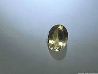 Front view of oval yellow Heliodor gemstone