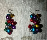 Front view of both earrings displaying multicolour bells and fish-hook wires