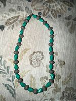 Full view of necklace showing bead pattern and clasp