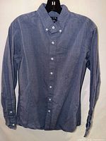 Full front view of blue J.Crew button-down shirt on hanger