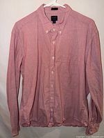 Full front view of red J.Crew button-down shirt on hanger