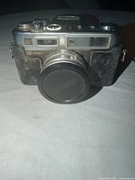 Front view of camera with lens cap attached
