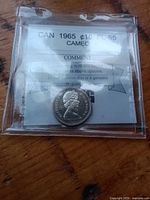Obverse view of 1965 silver dime in graded holder