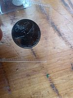 Obverse of 2000 Canadian dove quarter in holder