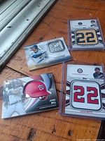 Group shot of four Topps commemorative cards