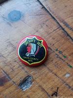 Front view showing shield graphic, text and overall design