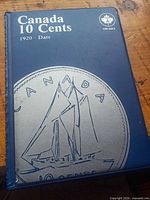 Front cover of blue Uni-Safe Canada 10 Cents coin album