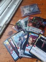 Overview of all trading cards spread on table