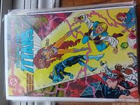 Cover of The New Titans issue featuring Starfire, Nightwing, others