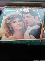 Front cover with Travolta and Newton-John