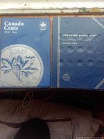 Front covers of two coin albums showing titles Canada Cents 1920-Date and Canadian Small Cent Collection 1973 to Date Number Two