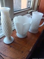 Three milk glass pieces grouped: vase, bowl, mug
