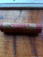 Entire sealed penny roll showing wrapper text PENNIES