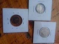 All three coins in 2×2 cardboard flips