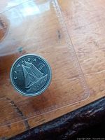 Obverse view of 2010 Canadian silver dime in sleeve