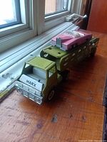 Marx hauler truck with Dinky car loaded on trailer