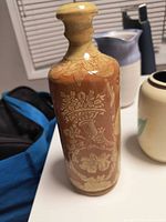 Full view of vase showing floral sgraffito side