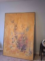 Full view of framed painting leaning against wall