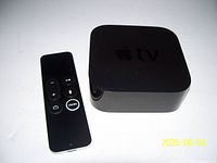 Apple TV unit and Siri Remote front view