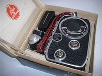 Camera, extra lens, strap and accessories inside branded box