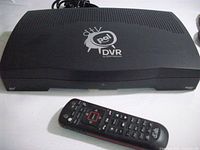 Front view of Dish Network DVR Pal unit with remote in foreground