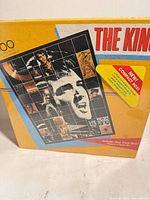Front of sealed 500-piece Elvis puzzle box showing mosaic portrait and "The King" title