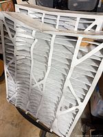 Two pleated furnace filters in frames