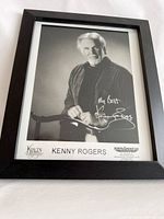 Front view of framed signed Kenny Rogers photograph