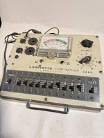 Top view showing Lafayette TE-15 tube tester with meter, sockets, controls, power cord
