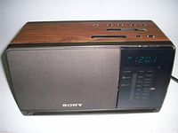 Front view showing Sony speaker grille and LED display