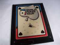 Front view of World Poker Tour wall clock showing logo, frame, and hands