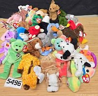 Pile of assorted Ty Beanie Babies showing quantity and tags attached