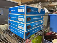 Stack of four Leuchtturm Volterra Trio boxes on shelf