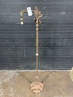 Full view of ornate metal floor lamp