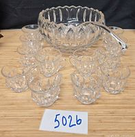 Overall view of punch bowl, 12 cups, and ladle