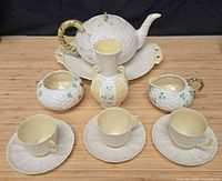 Complete 11-piece Belleek set on display