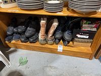 Shelf view showing all footwear pairs including boots, velcro shoes, inline skates and boxed shoes